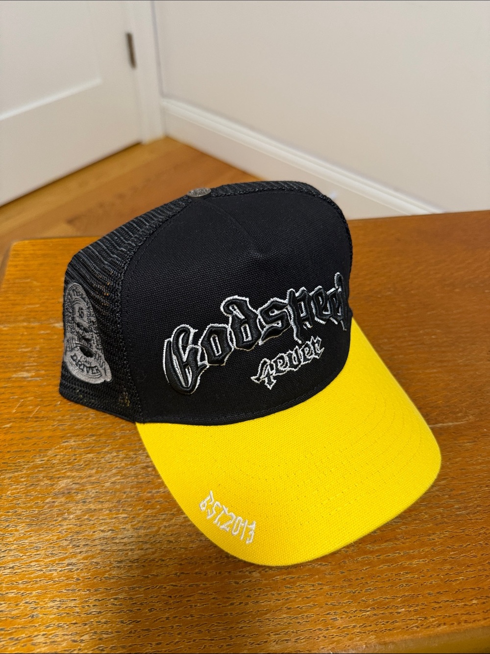 Never Two-Tone Black and Yellow Trucker Hat